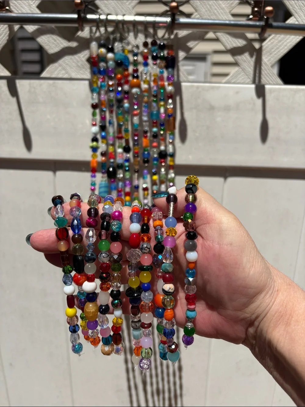 10 strands 26 inches long made with glass & crystal beads